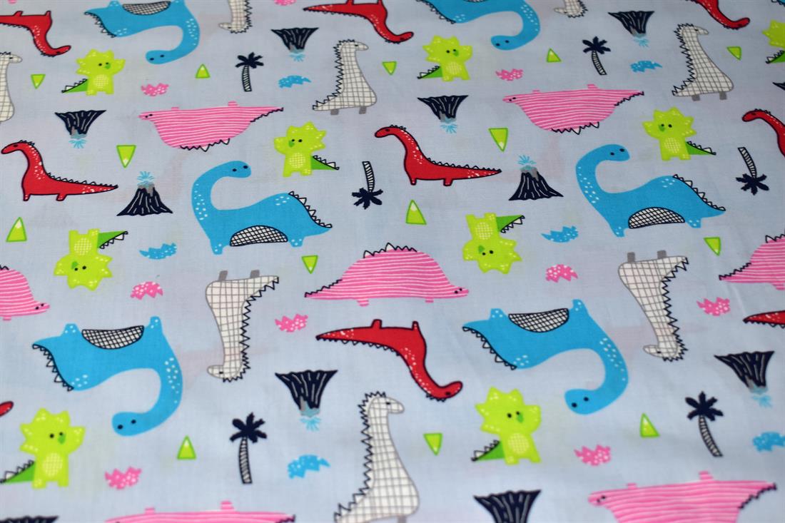 Light Blue Dinosaurs Printed Crafty Cottons Poplin