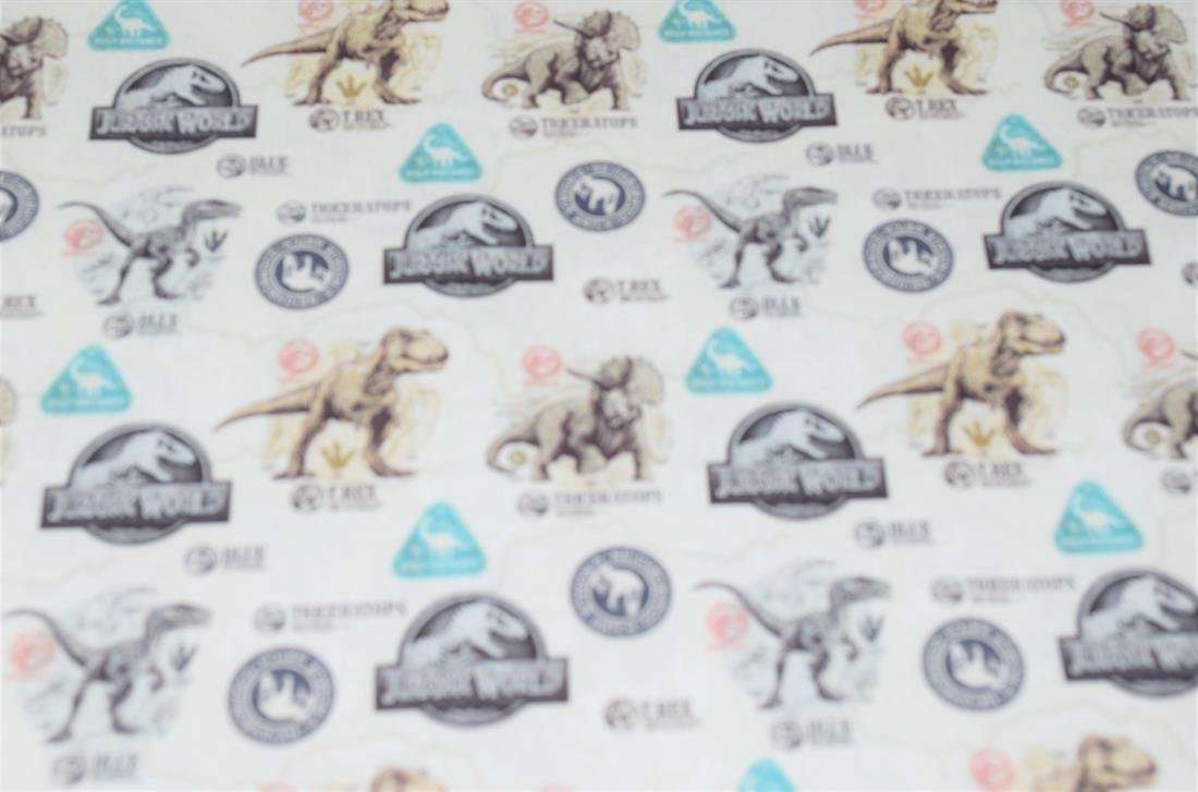 Cream Jurassic World Badge Cotton Printed Fabric