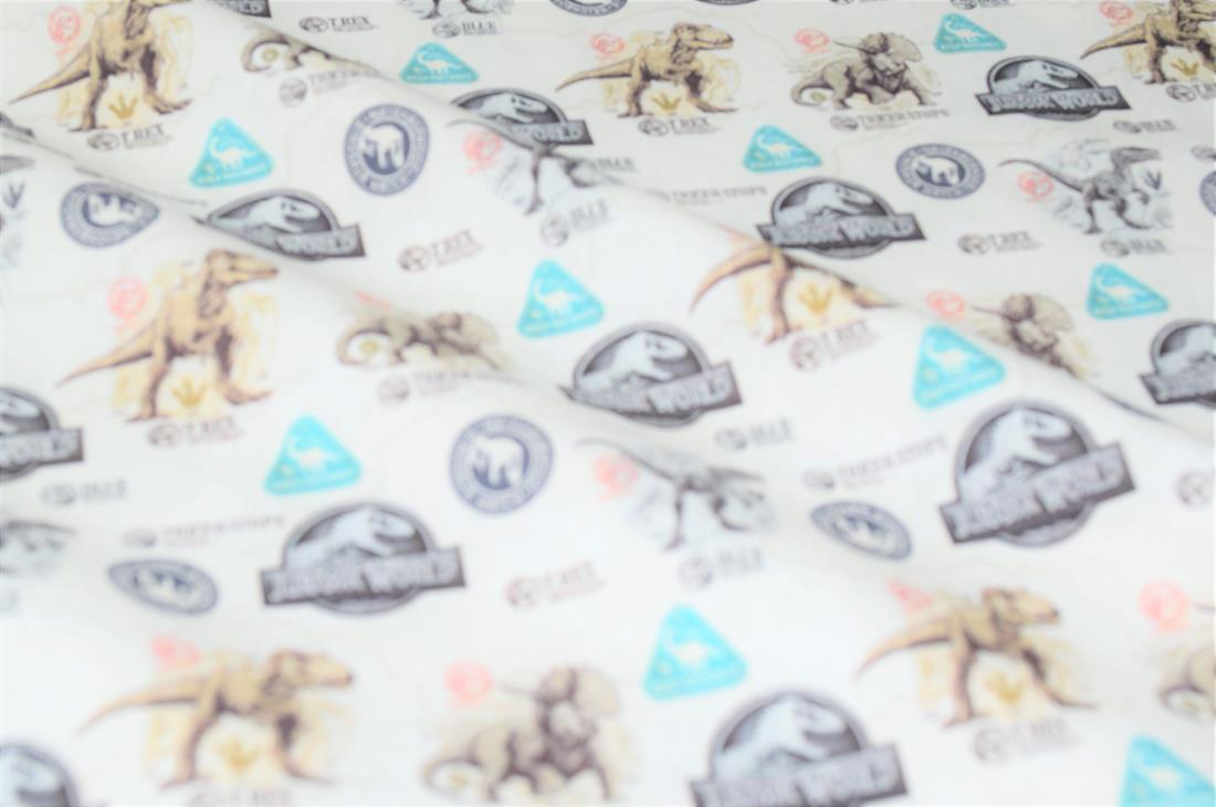 Cream Jurassic World Badge Cotton Printed Fabric