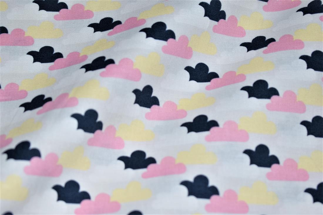 Cotton Printed Christmas with a Variety of Coloured Clouds Fabric