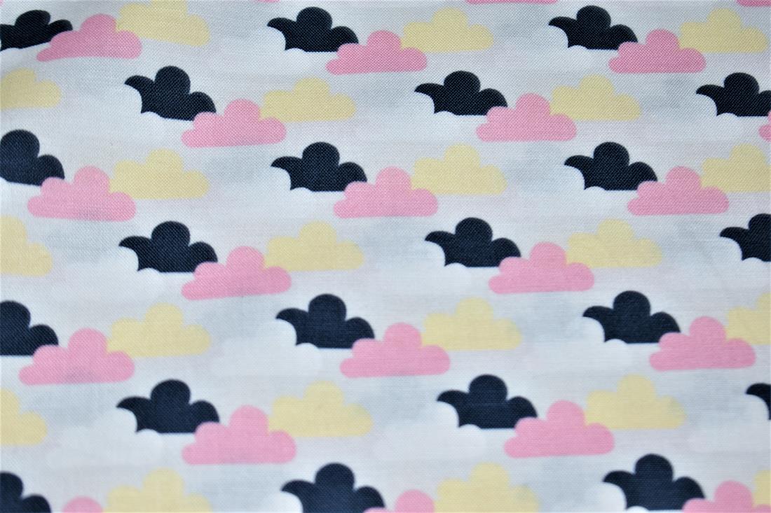 Cotton Printed Christmas with a Variety of Coloured Clouds Fabric