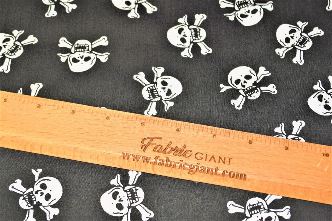 Black Skull and Cross Bones All Over Printed Poly Cotton Fabric