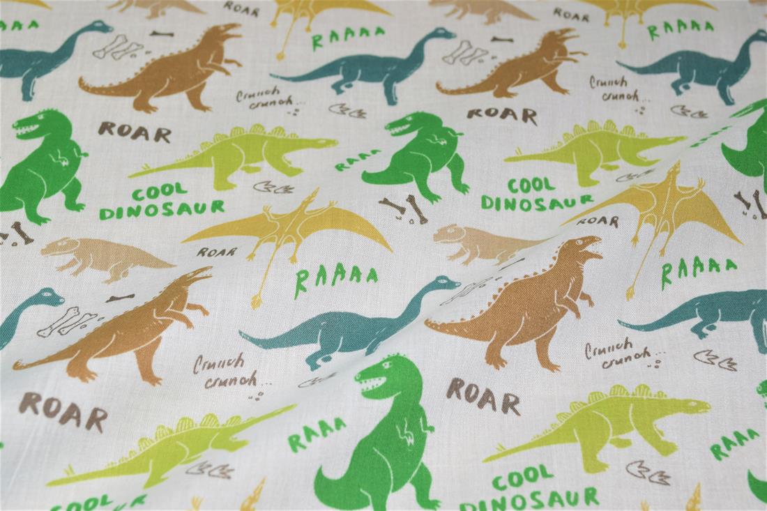 White Dinosaurs Printed Poly Cotton Fabric