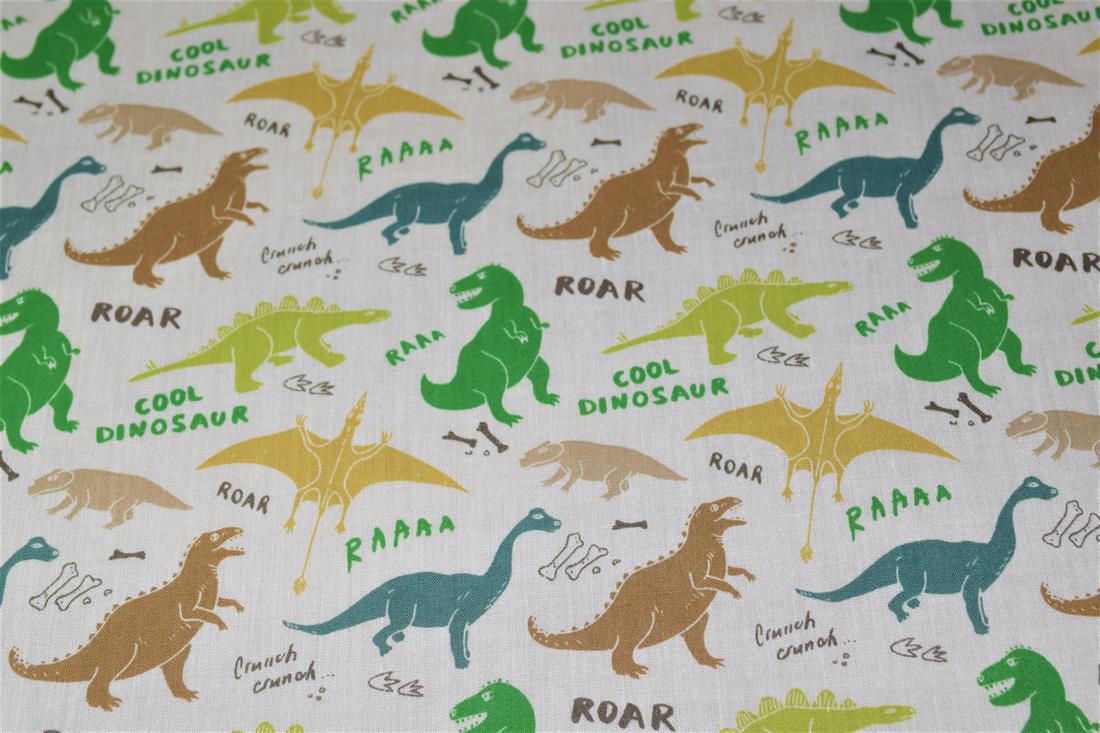 White Dinosaurs Printed Poly Cotton Fabric