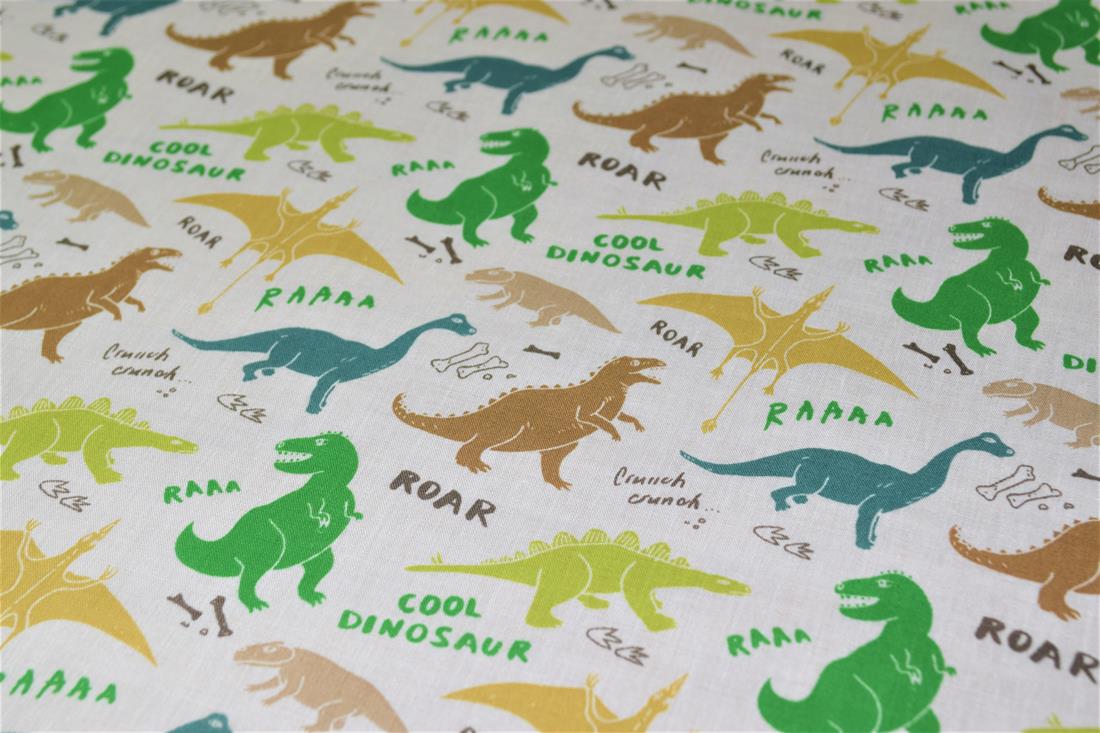 White Dinosaurs Printed Poly Cotton Fabric