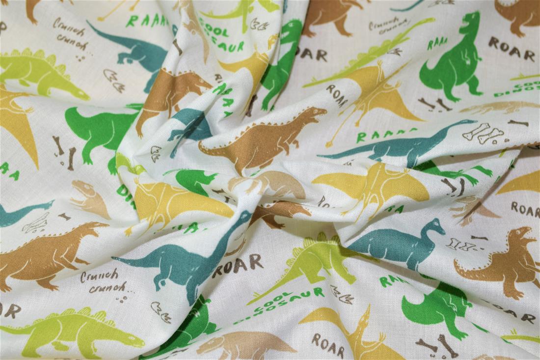 White Dinosaurs Printed Poly Cotton Fabric