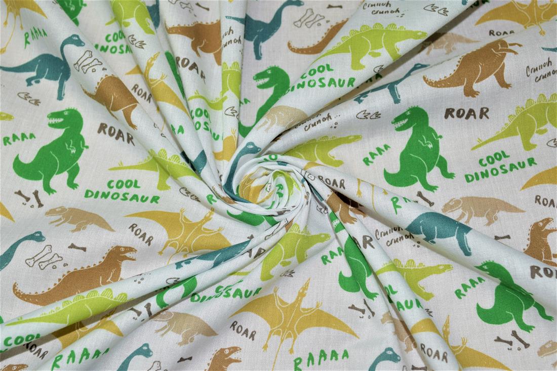 White Dinosaurs Printed Poly Cotton Fabric