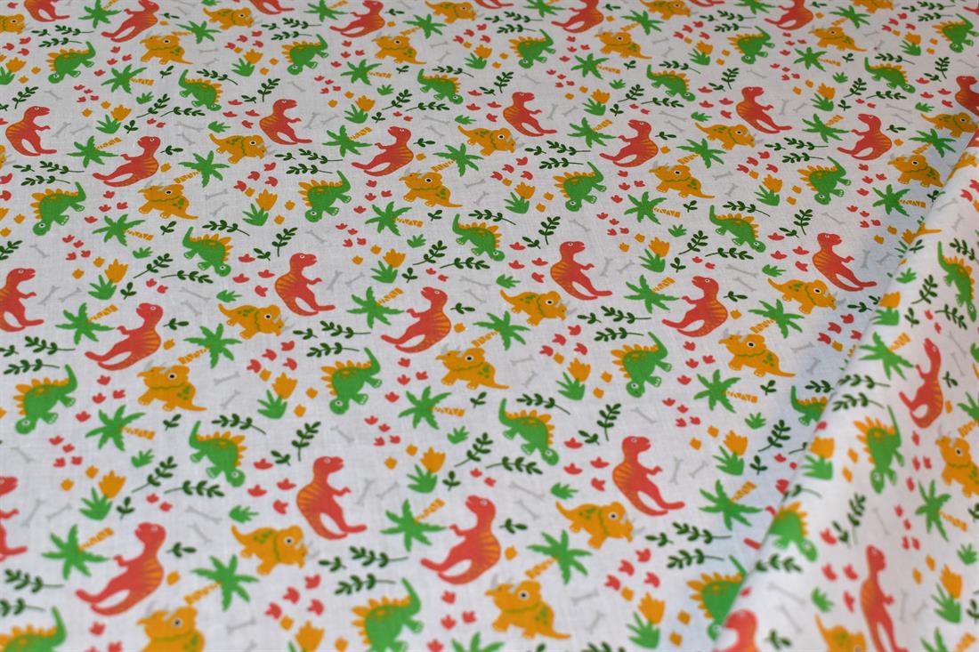 White Printed Dinosaur Polycotton Fabric