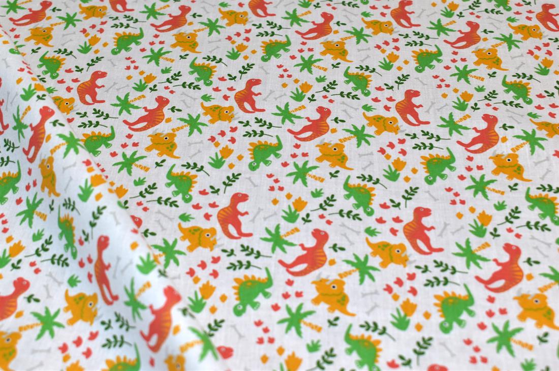 White Printed Dinosaur Polycotton Fabric