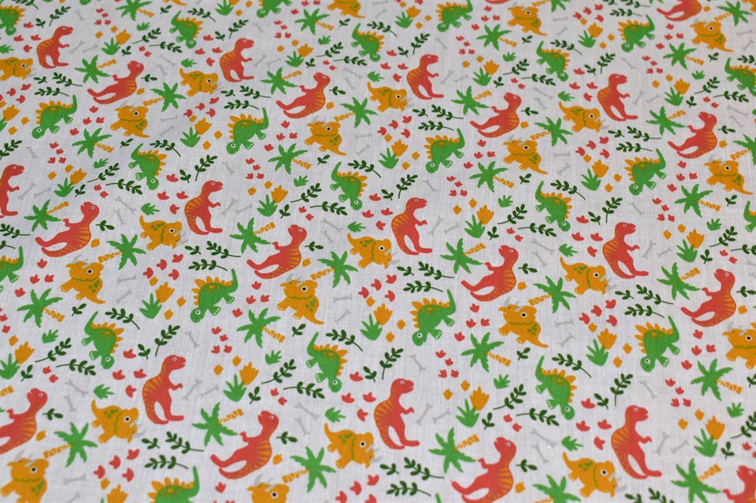 White Printed Dinosaur Polycotton Fabric