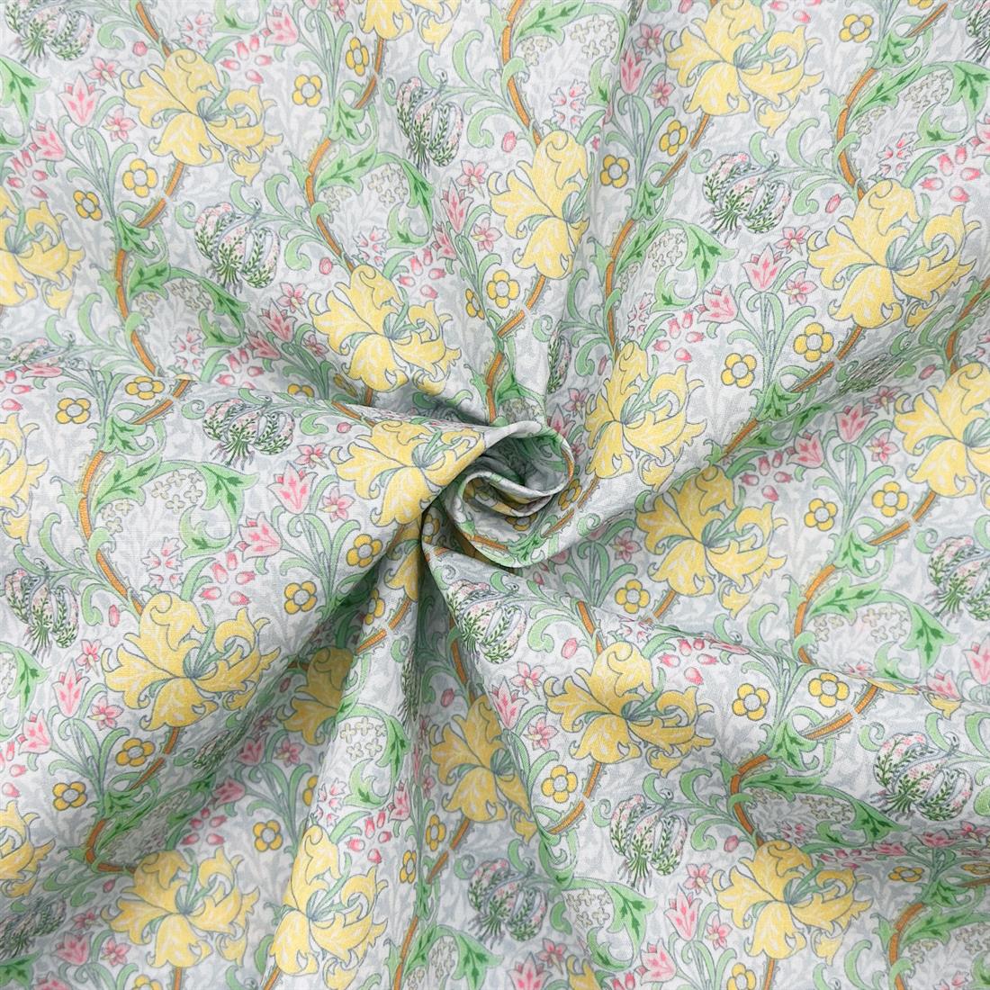 Golden Lily Pastel Green Printed Polycotton FabricThis Beautiful…