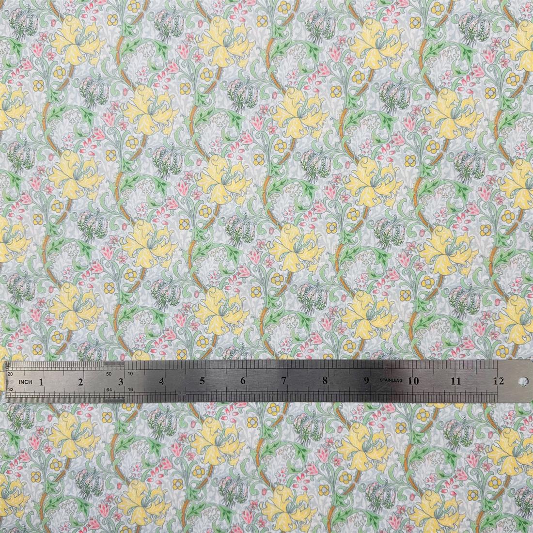 Golden Lily Pastel Green Printed Polycotton FabricThis Beautiful…